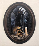 Black Cat sitting on skull in Frame Wall Slaps Decal
